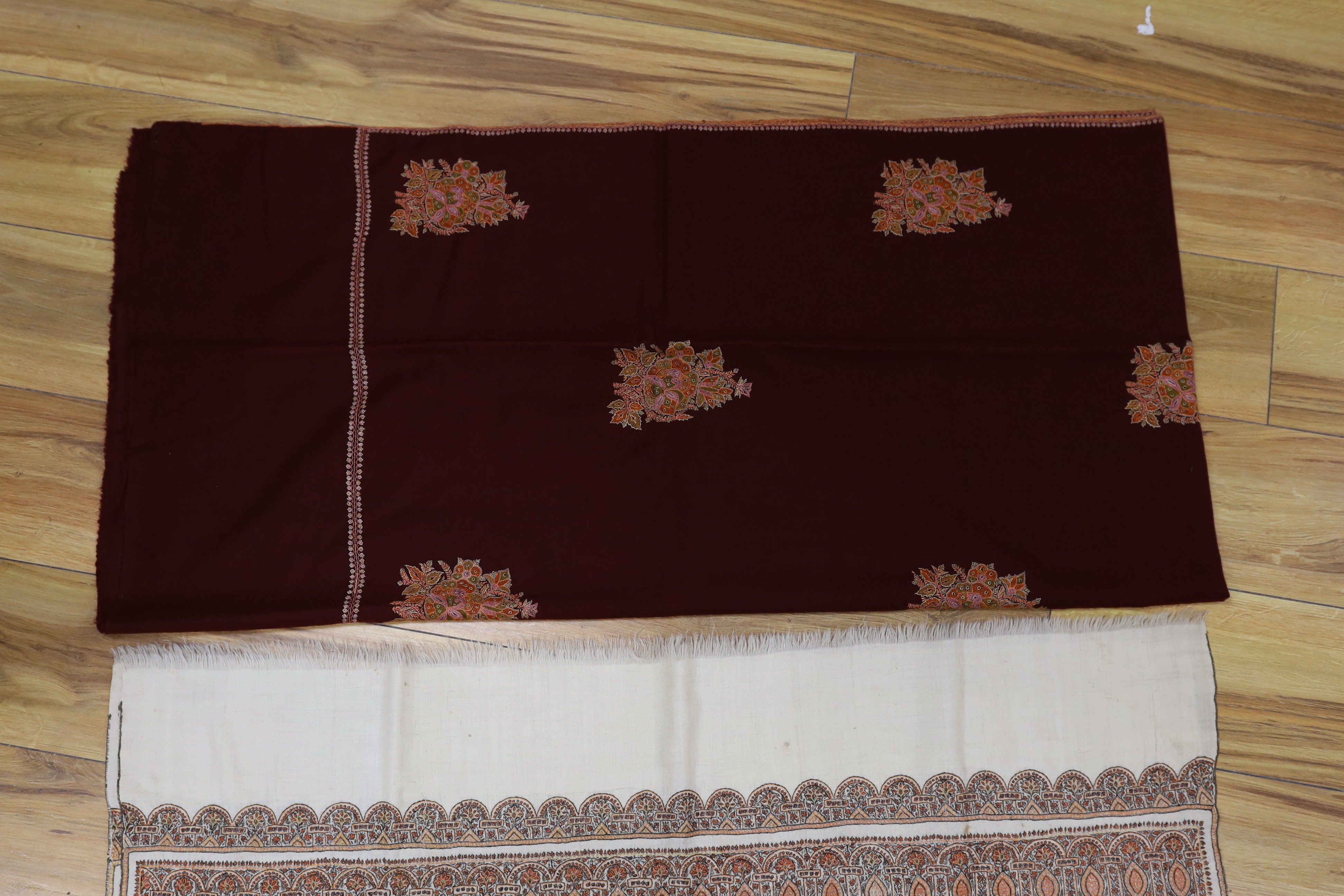 An Indian 20th century pashmina silk embroidered shawl and a cashmere wool shawl with spot motif embroidery